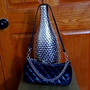 Unknown, small, black faux leather quilted shoulder purse.